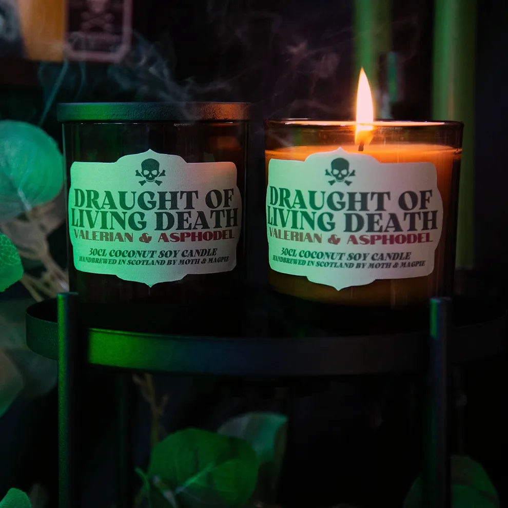 Two candles labeled 'Draught of Living Death' with a dark background
