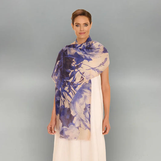 Woman wearing a china blue blooms scarf on a gray background