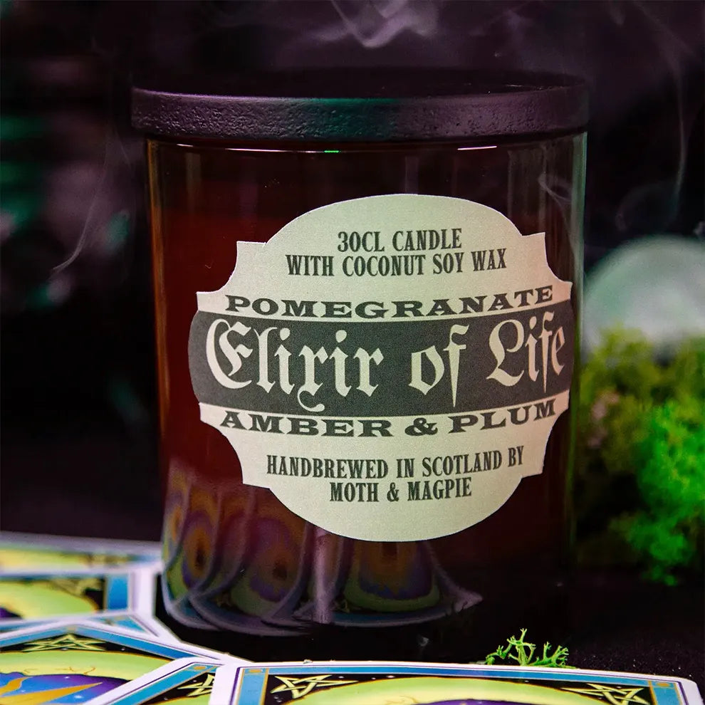Candle labeled 'Elixir of Life' with a mystical background
