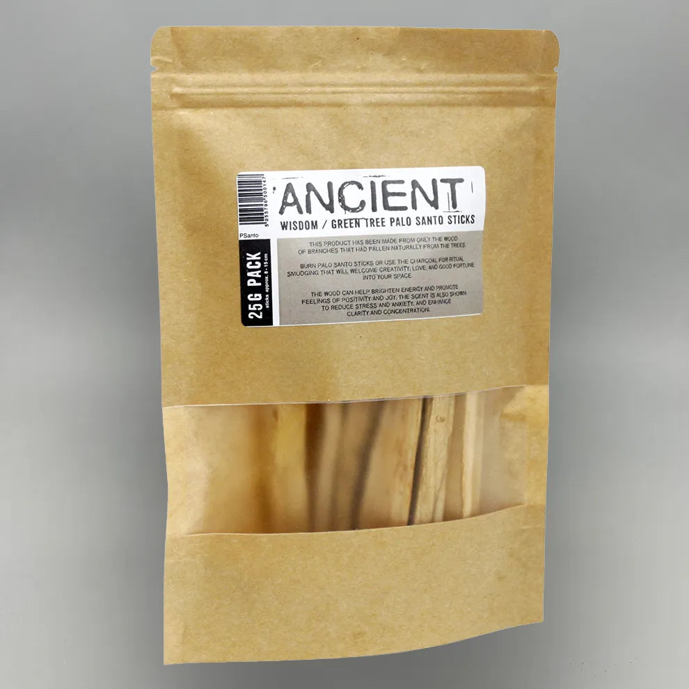 Kraft paper packaging containing green tree santo sticks on a gray background