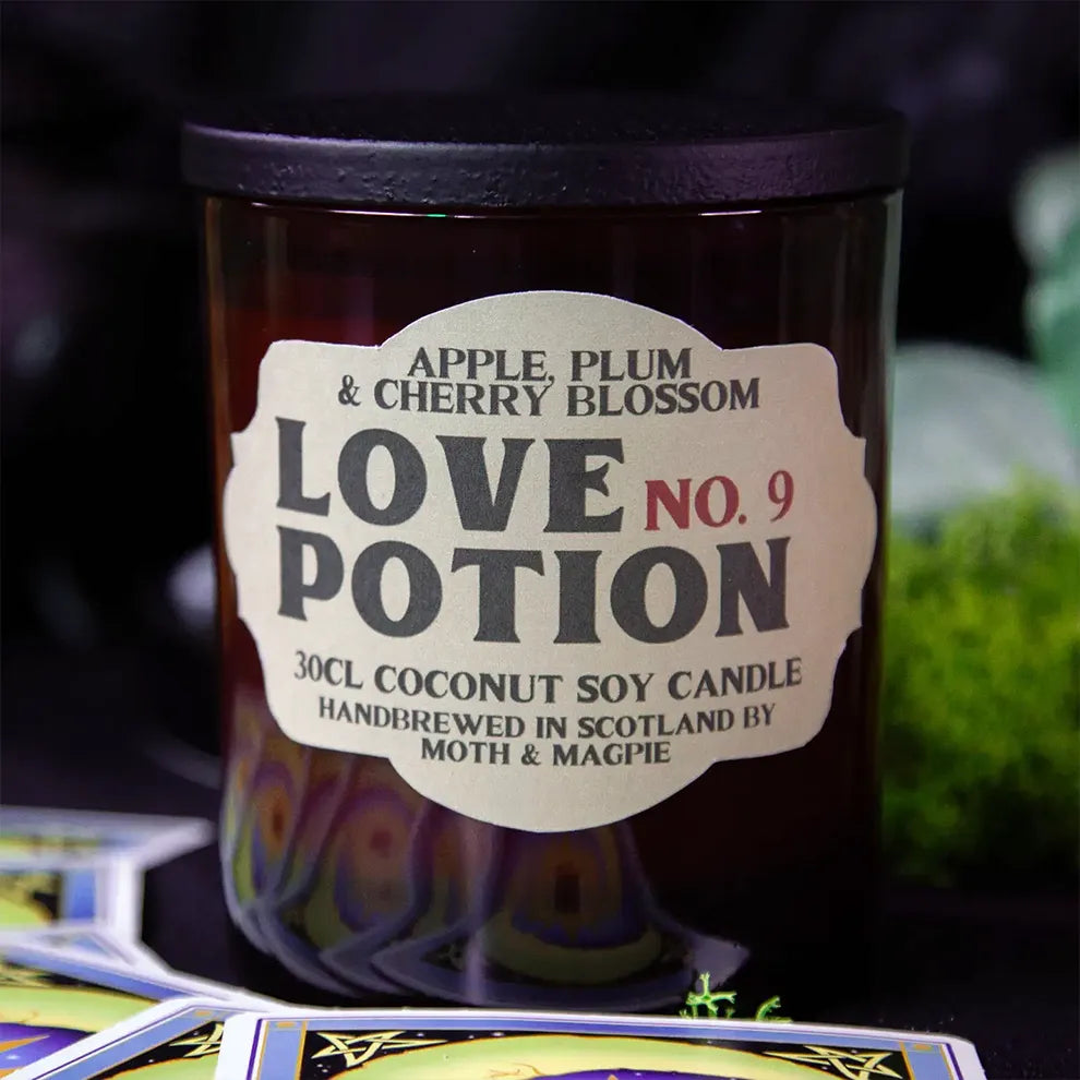 Candle labeled 'Love No. 9' with a mystical background