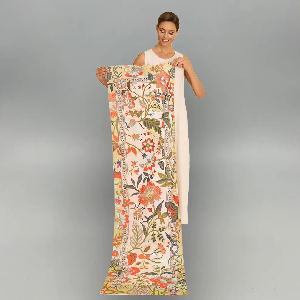 Women hold a pattern palms scarf on a gray background