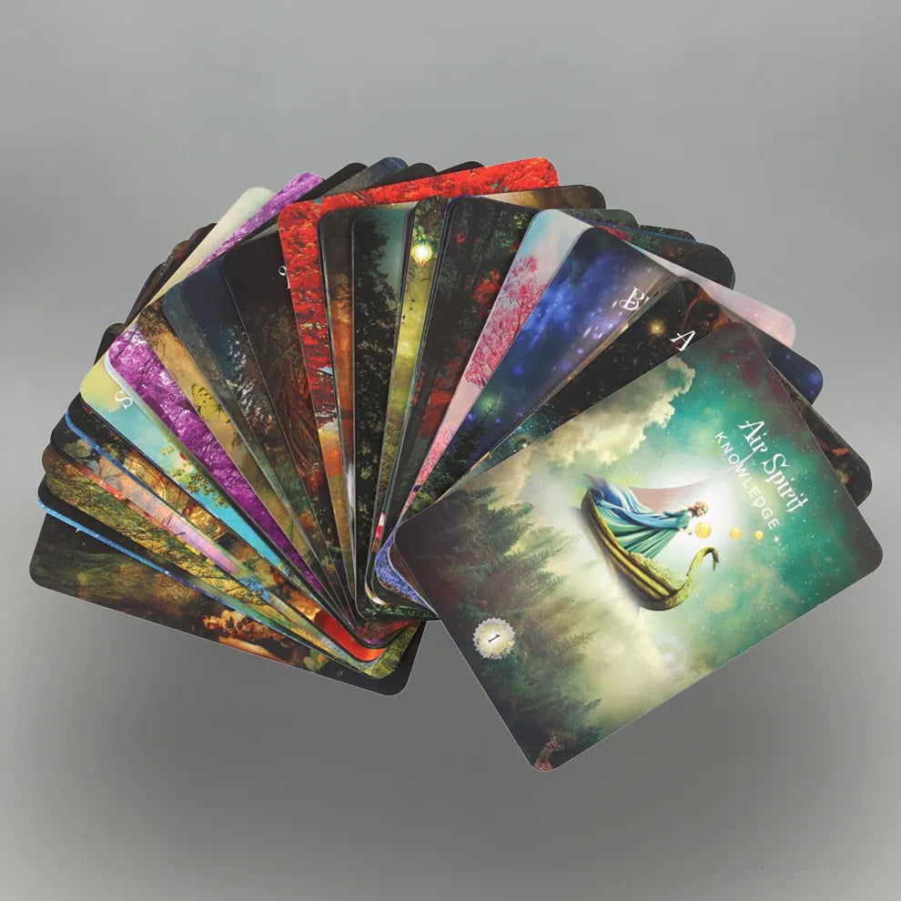 Fanned deck of colorful 'The Sacred Forest Oracle' tarot cards on a gray background