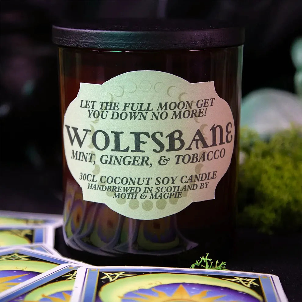 Wolfsbane candle with label on a dark background