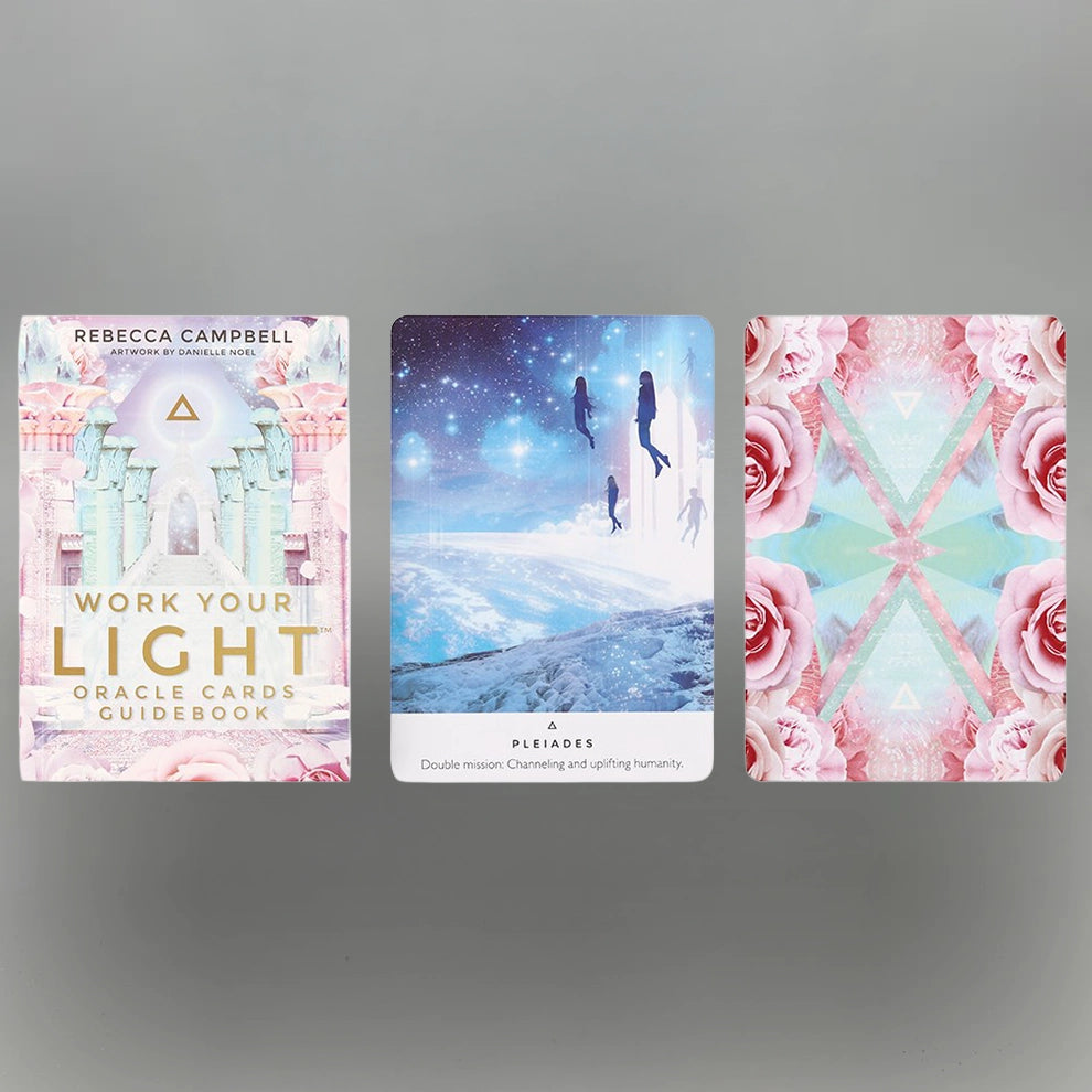 Set of 'Work Your Light' oracle cards with a guidebook on a gray background